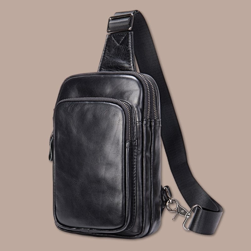 http://www.la-sacoche-parisienne.com/cdn/shop/files/sacoche-bandouliere-homme-cuir-noir-15-5cm-x-25cm-x-5cm-50416401219930.jpg?v=1699115385